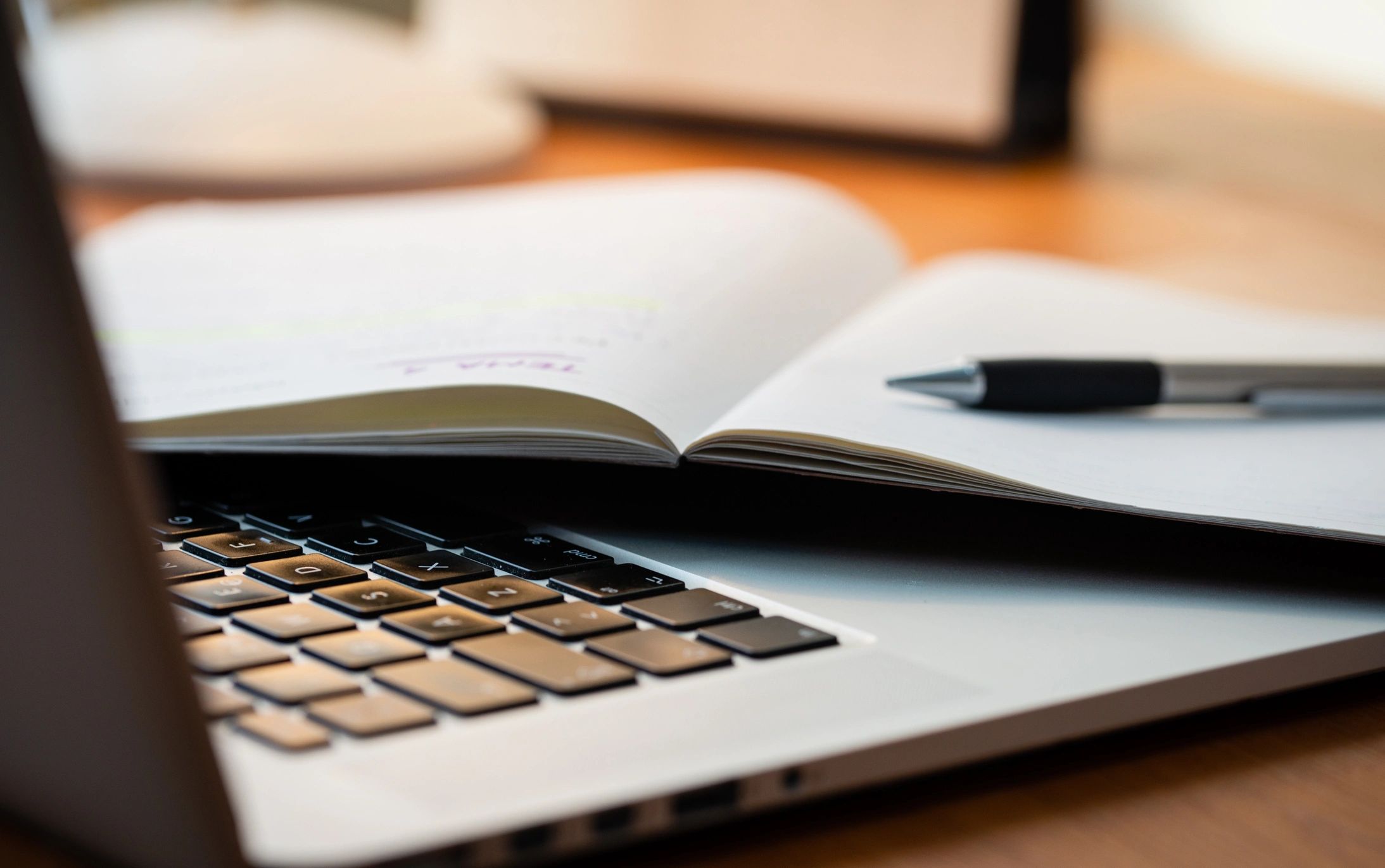 Writer workspace with laptop and notepad