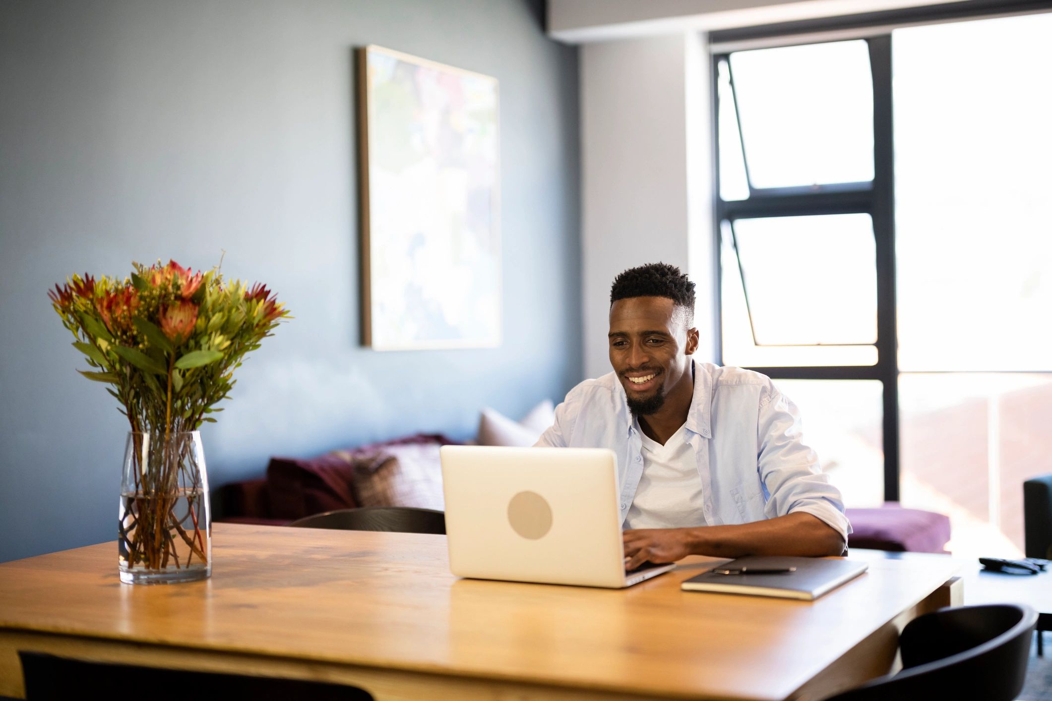 Person studying and working on a laptop at home