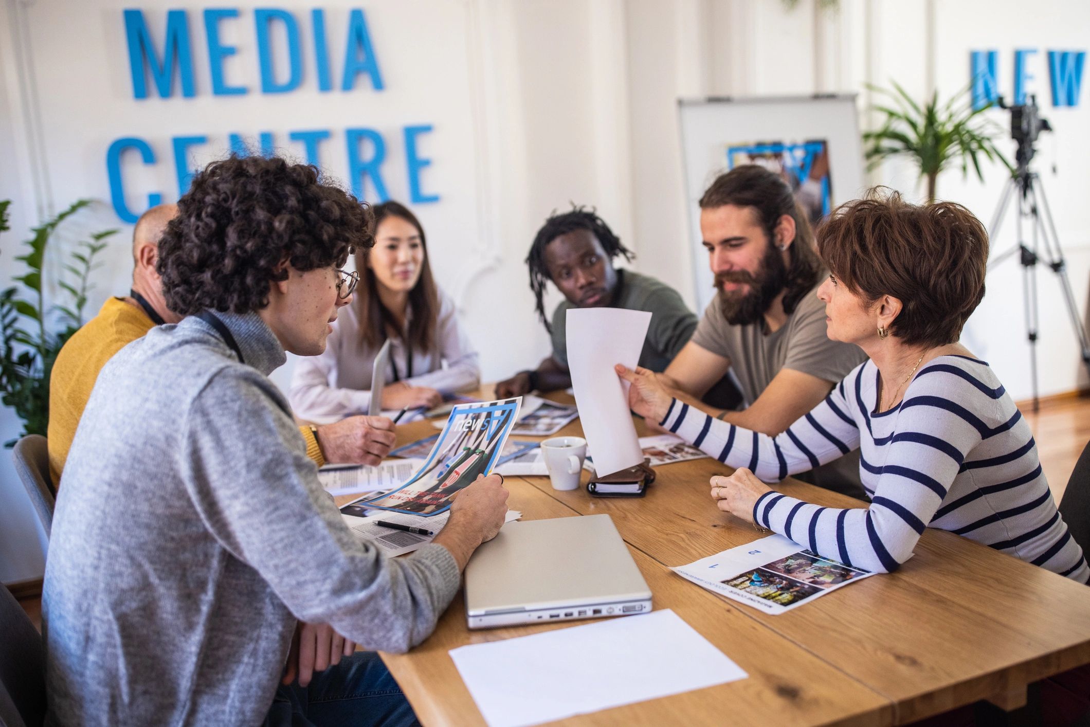 Editorial team meeting around a table