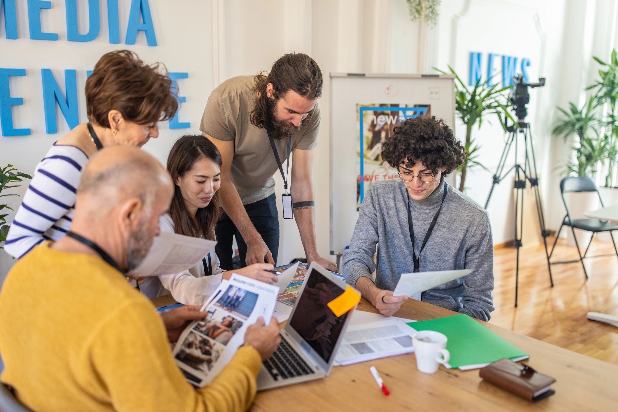 Editorial team collaborating in a modern office