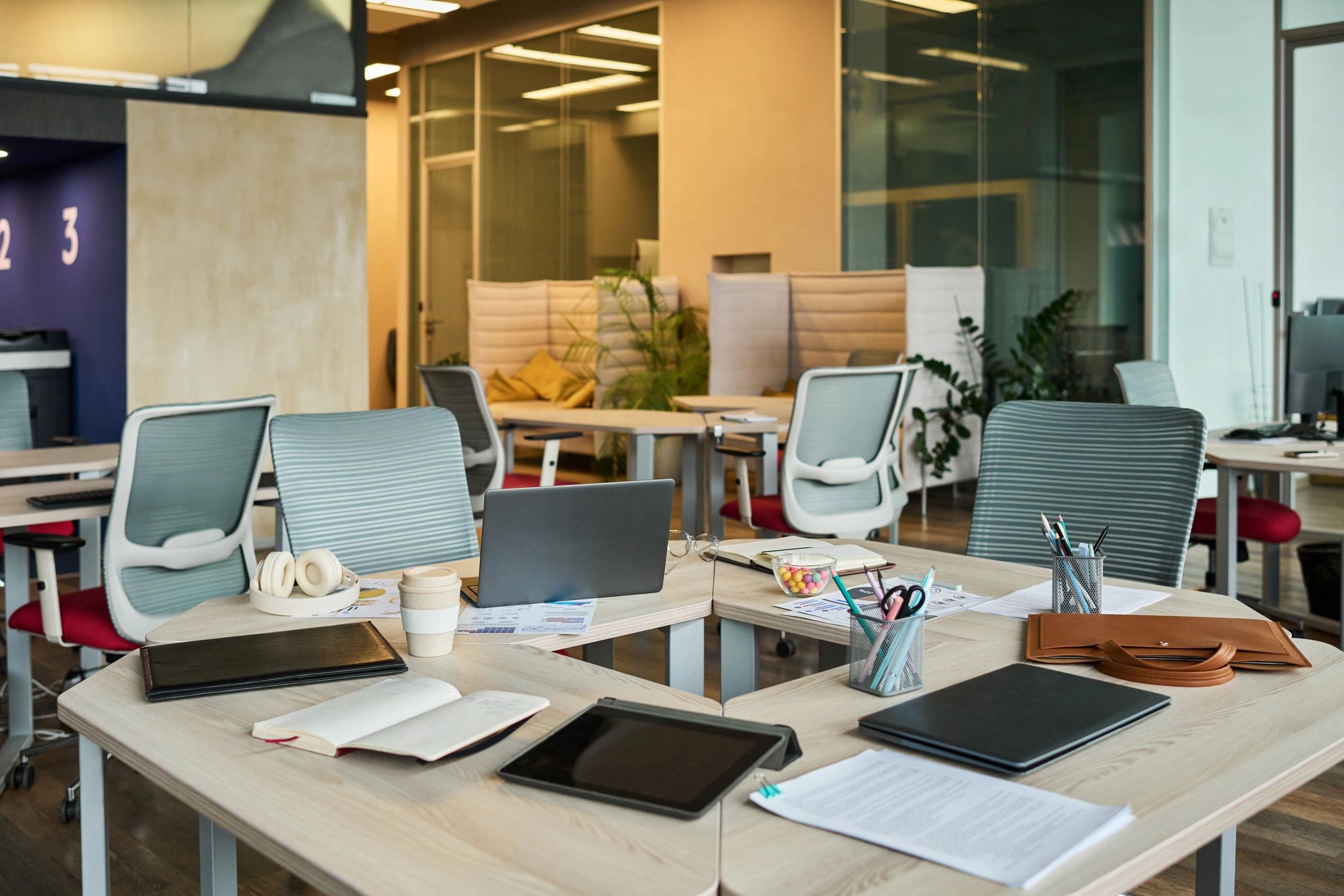 Organized office workspace with laptops and documents