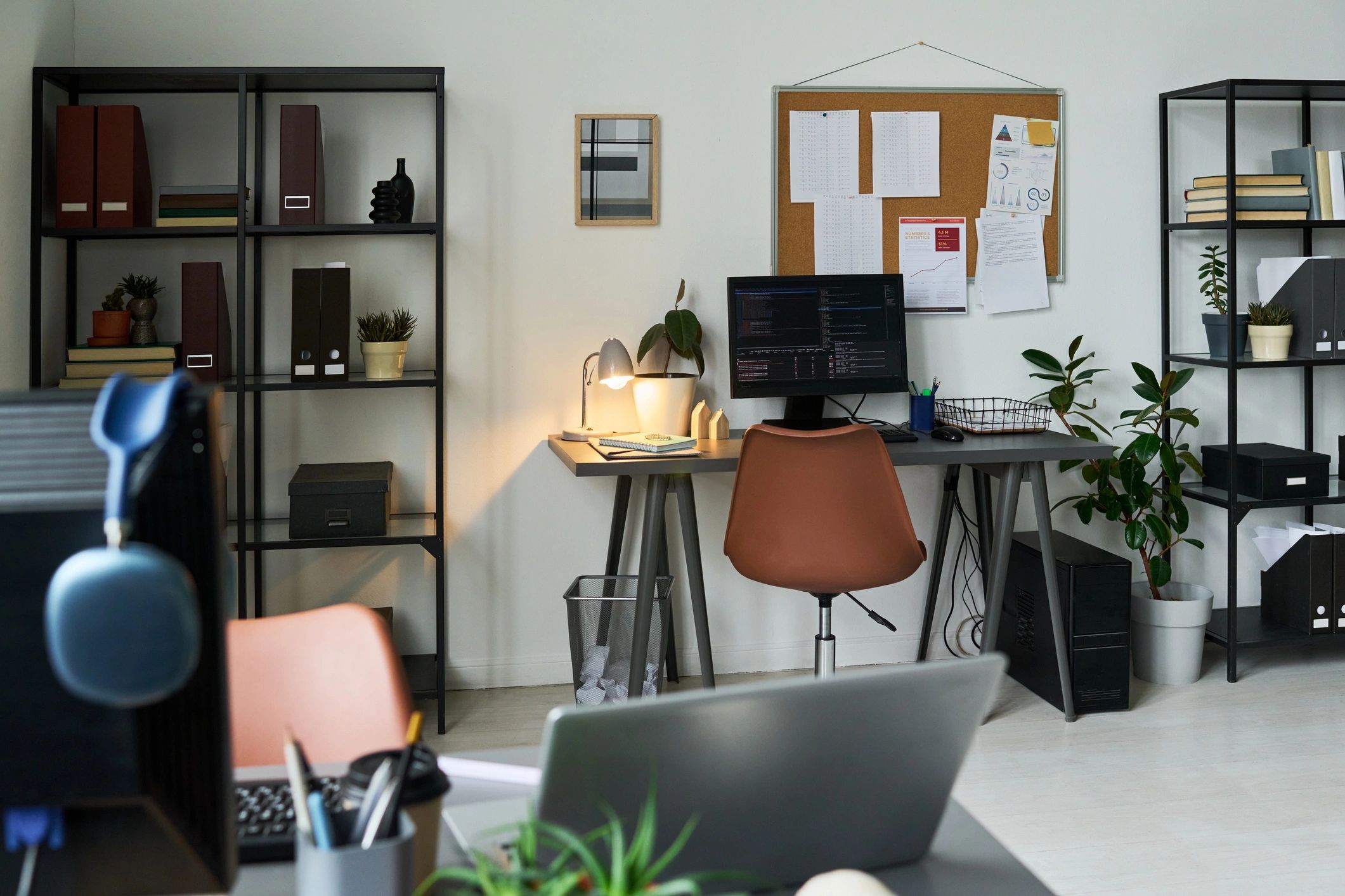 Modern editorial workspace with computer and desk